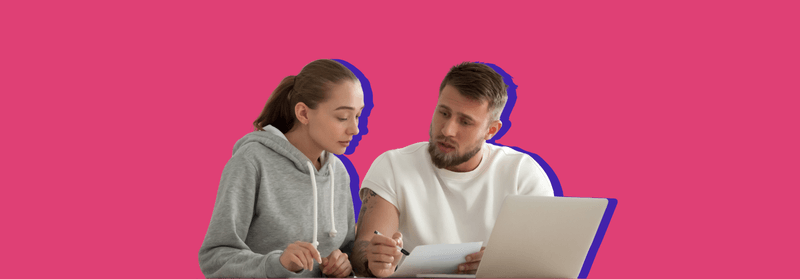 A young woman and man reviewing documents at a laptop together, set against a pink background.