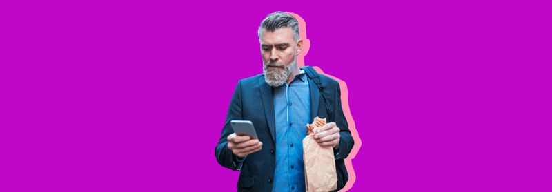 An older man in a blazer holding a smartphone, set against a purple background.