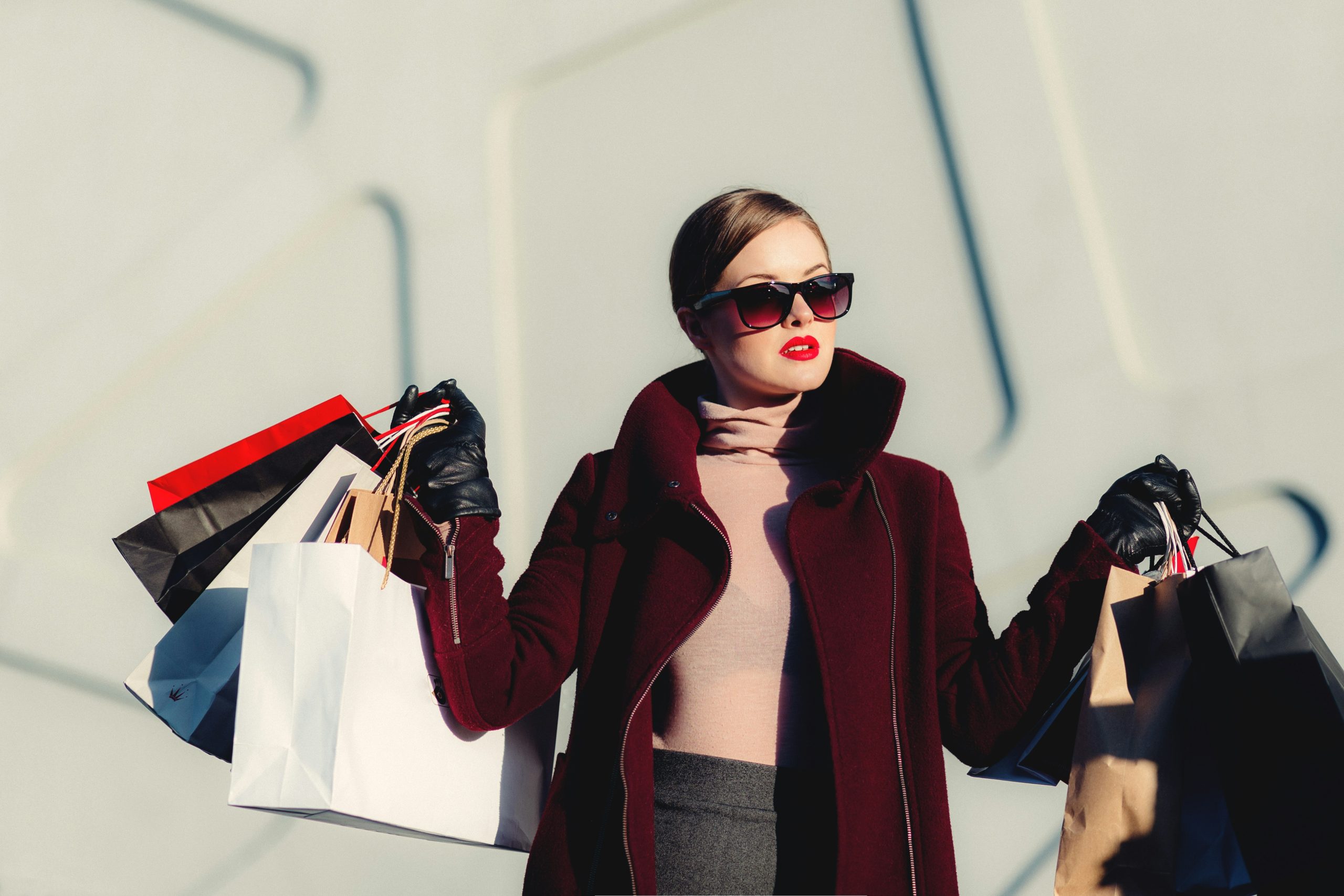 affluent female consumer holding shopping bags